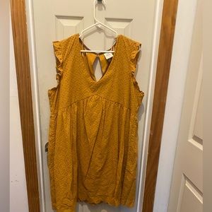New dark mustard yellow dress has a v neck and under layer is silk